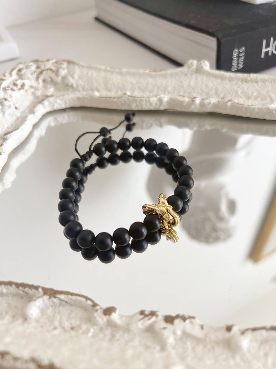 Black onyx men's bracelet with elephant charm