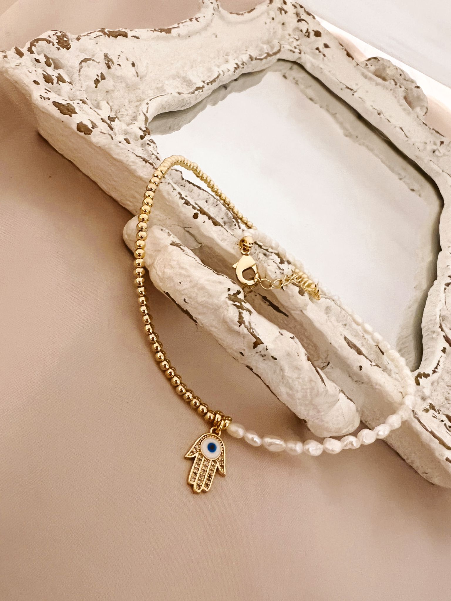 Gold Necklace with Half Pearl and Hamsa Hand Charm