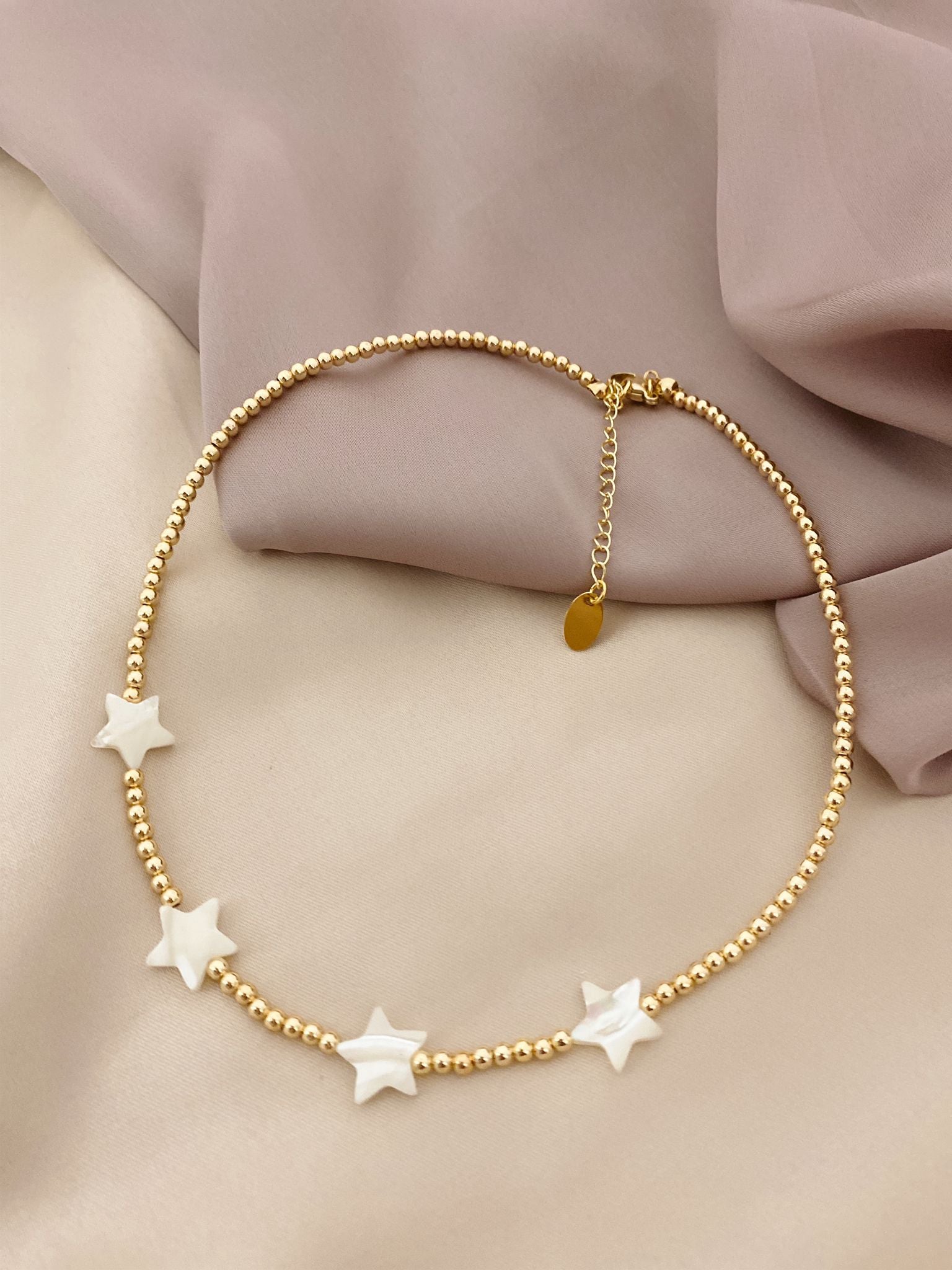 Gold necklace with mother of pearl Stars