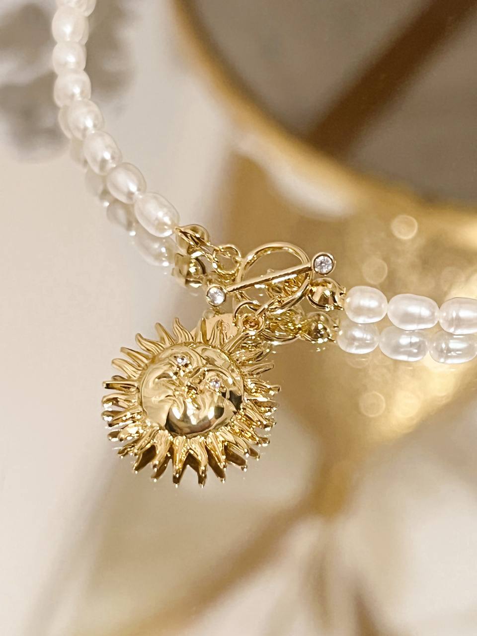 Pearl sun necklace