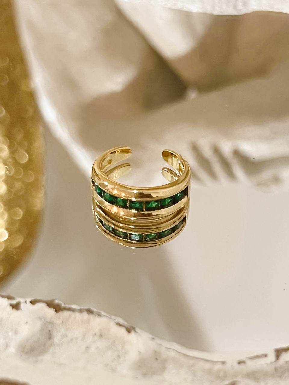 Ring with green stones